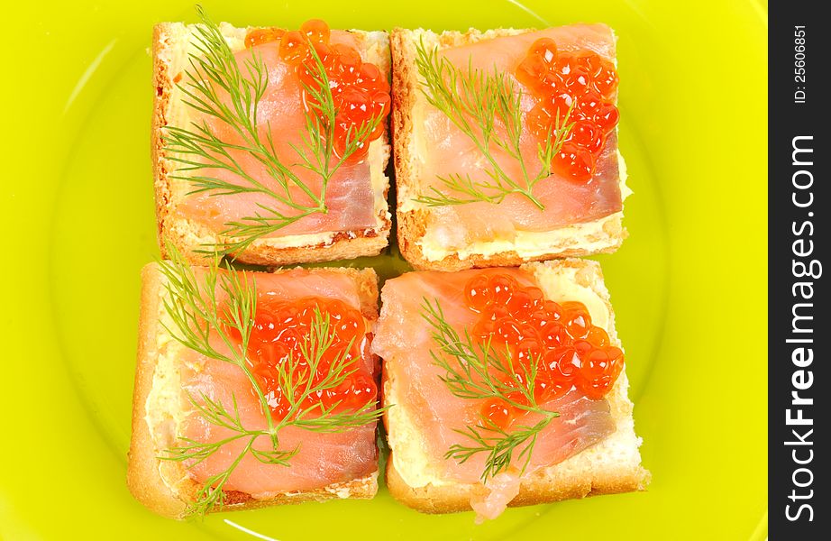 Red coviar and smoke salmon canape ,on a green plate,. Red coviar and smoke salmon canape ,on a green plate,