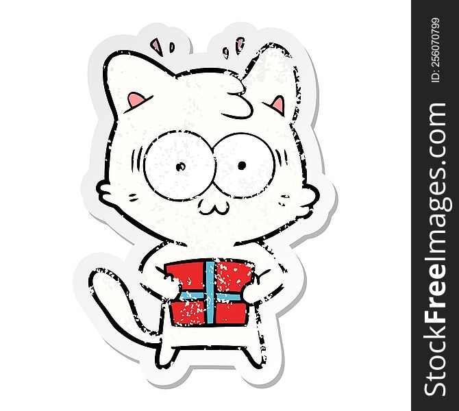 distressed sticker of a cartoon surprised cat with christmas present