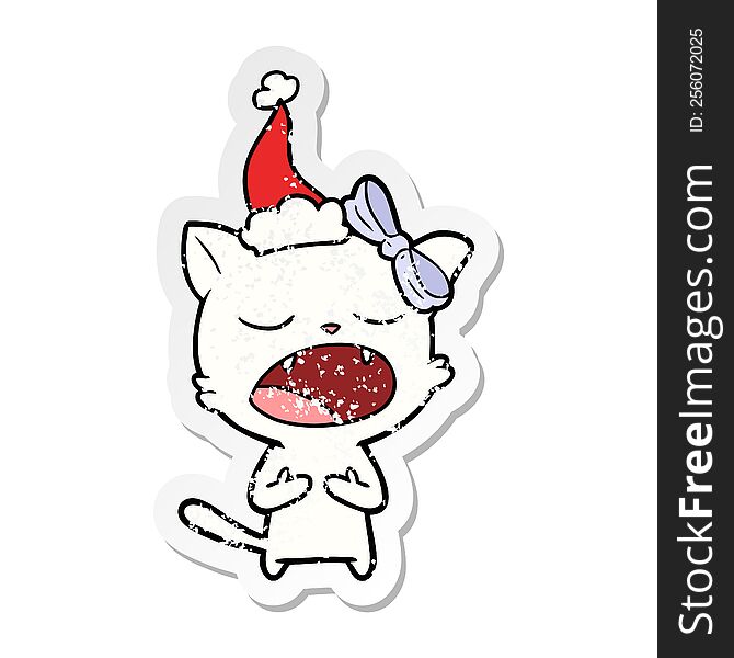 Distressed Sticker Cartoon Of A Cat Meowing Wearing Santa Hat