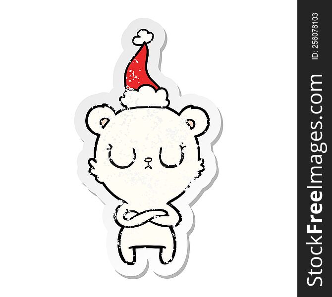 peaceful hand drawn distressed sticker cartoon of a polar bear wearing santa hat