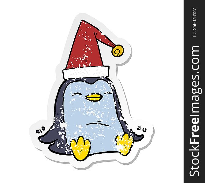 Distressed Sticker Of A Cartoon Penguin Wearing Christmas Hat