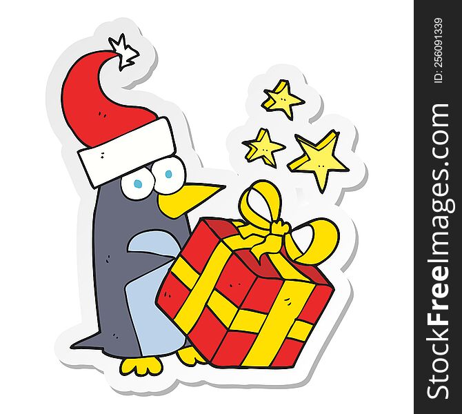 Sticker Of A Cartoon Christmas Penguin With Present