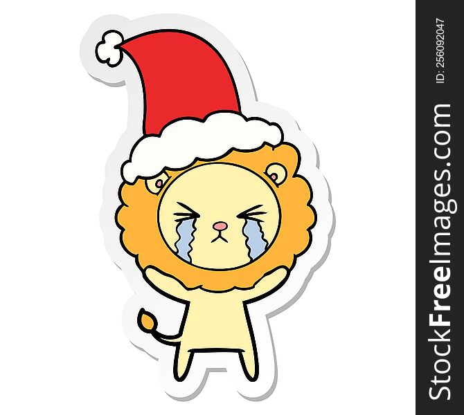 Sticker Cartoon Of A Crying Lion Wearing Santa Hat