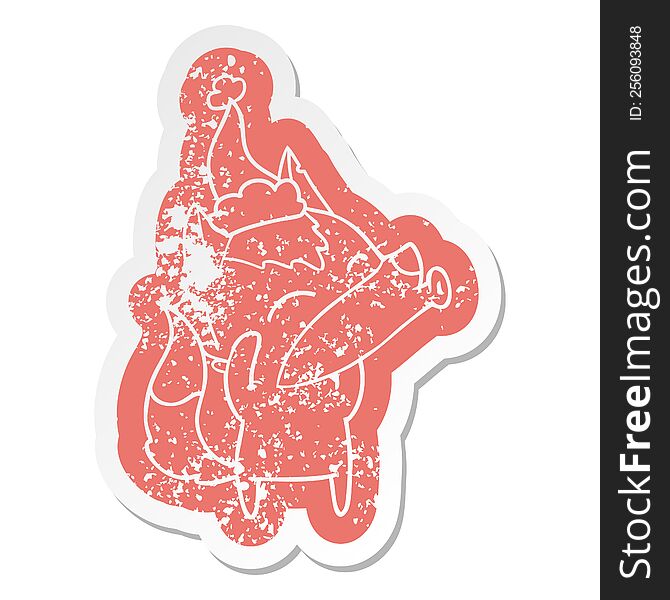 Howling Wolf Cartoon Distressed Sticker Of A Wearing Santa Hat