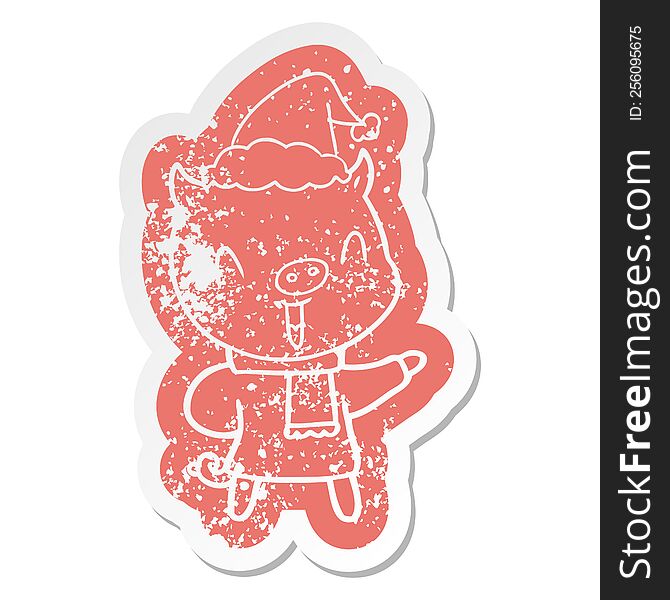 Happy Cartoon Distressed Sticker Of A Pig In Winter Clothes Wearing Santa Hat