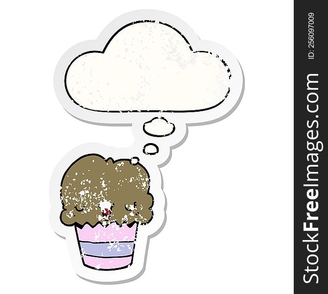 Cartoon Cupcake With Face And Thought Bubble As A Distressed Worn Sticker