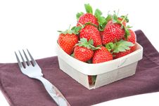 Composition Of Strawberries In A Basket And A Fork Royalty Free Stock Image