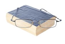 Glasses On The Ancient Book. Royalty Free Stock Photos