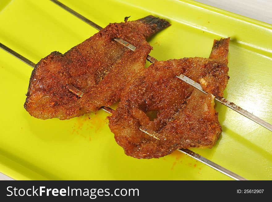 Barbecue; grilled fish on a plate