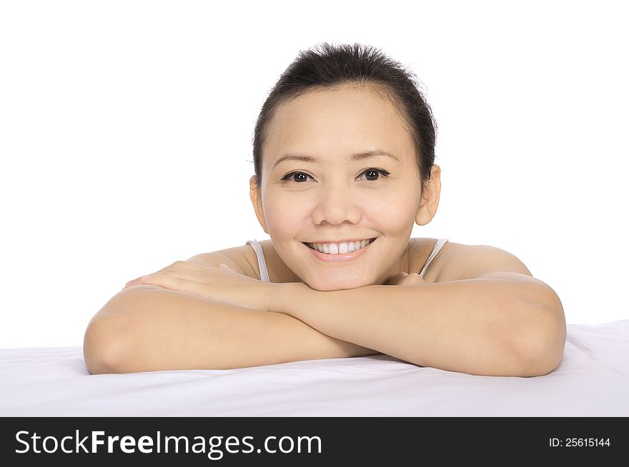 Close up of a brunette smiling woman relaxing on in a wellness center. Close up of a brunette smiling woman relaxing on in a wellness center