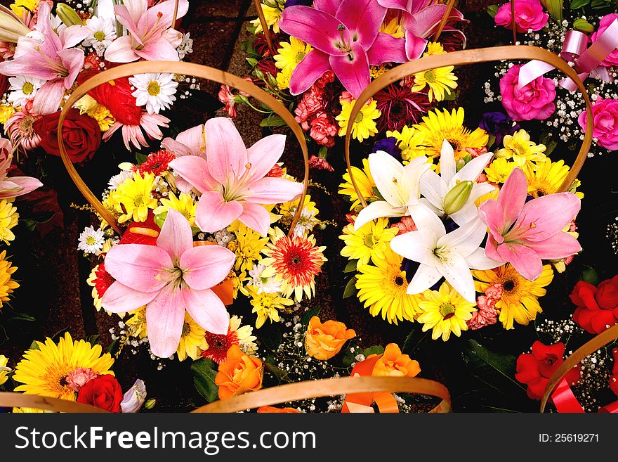 Beautiful bouquets of colorful flowers in wicker baskets. Beautiful bouquets of colorful flowers in wicker baskets.