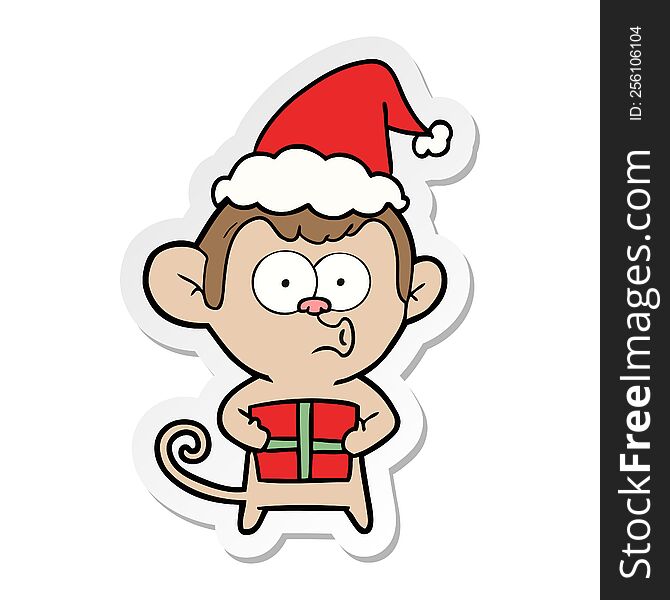 Sticker Cartoon Of A Christmas Monkey Wearing Santa Hat
