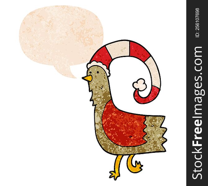 cartoon chicken in funny christmas hat and speech bubble in retro textured style