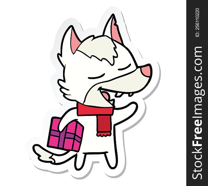 Sticker Of A Cartoon Wolf With Christmas Present Laughing