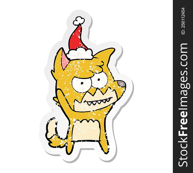 Distressed Sticker Cartoon Of A Grinning Fox Wearing Santa Hat