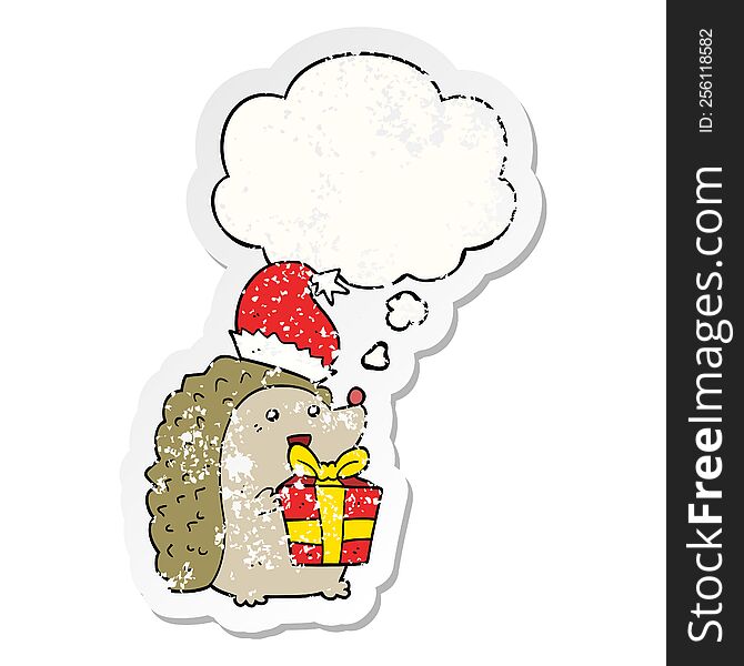 Cartoon Hedgehog Wearing Christmas Hat And Thought Bubble As A Distressed Worn Sticker