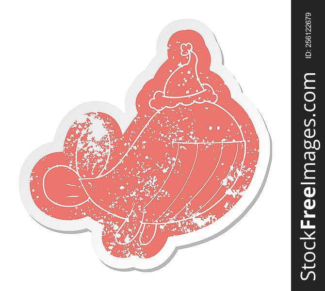 Cartoon Distressed Sticker Of A Whale Wearing Santa Hat