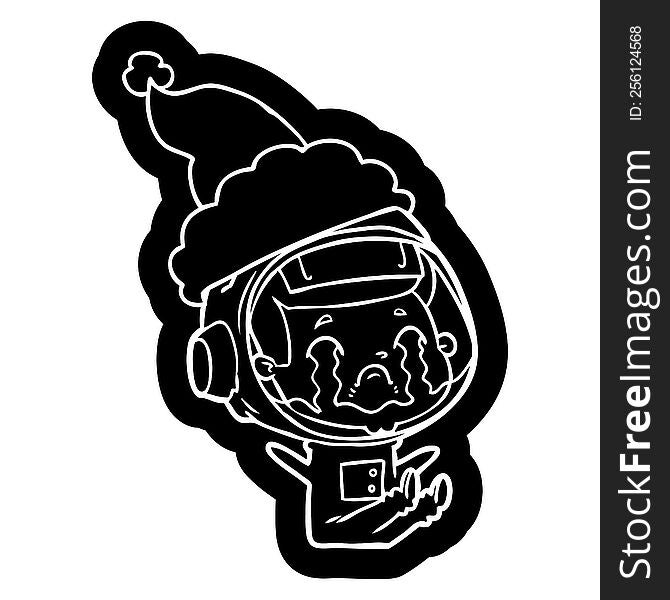 quirky cartoon icon of a crying astronaut wearing santa hat