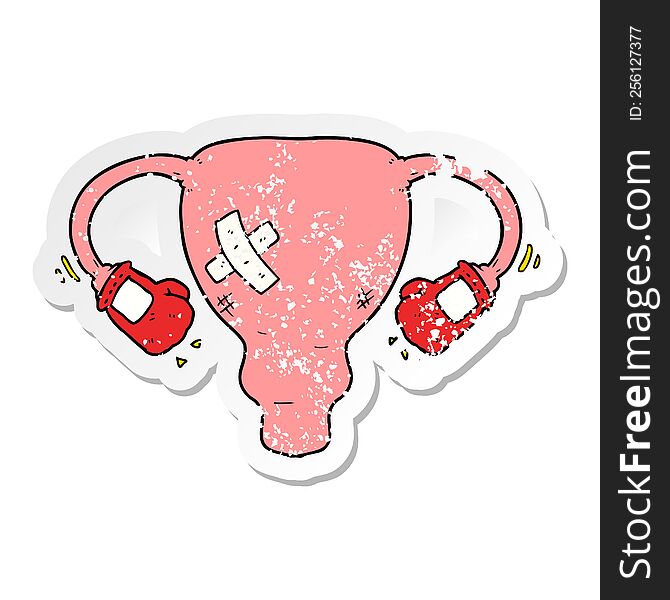 distressed sticker of a cartoon beat up uterus with boxing gloves