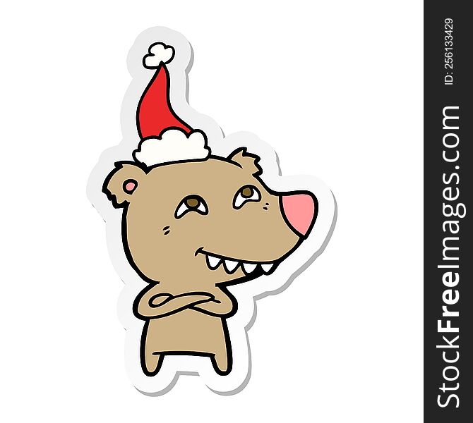 hand drawn sticker cartoon of a bear showing teeth wearing santa hat