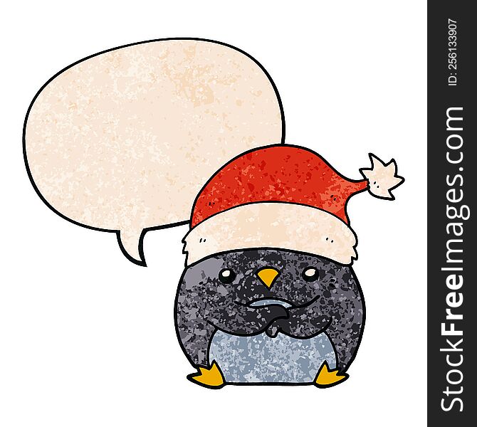 cute cartoon penguin wearing christmas hat and speech bubble in retro texture style