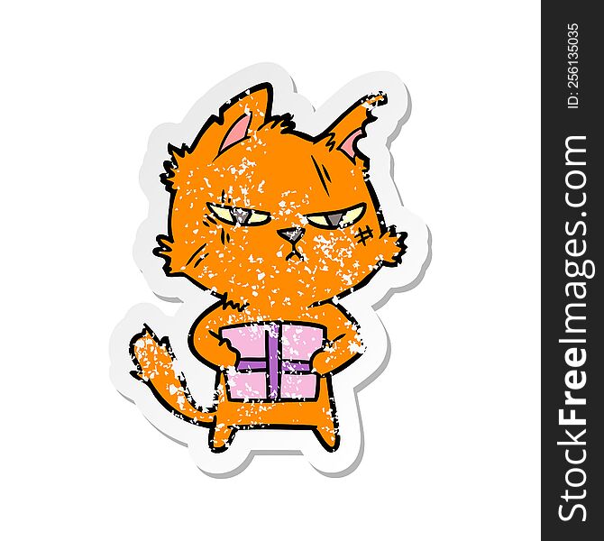 distressed sticker of a tough cartoon cat with christmas present