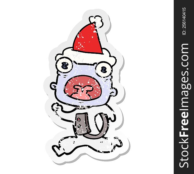 distressed sticker cartoon of a weird alien running away wearing santa hat