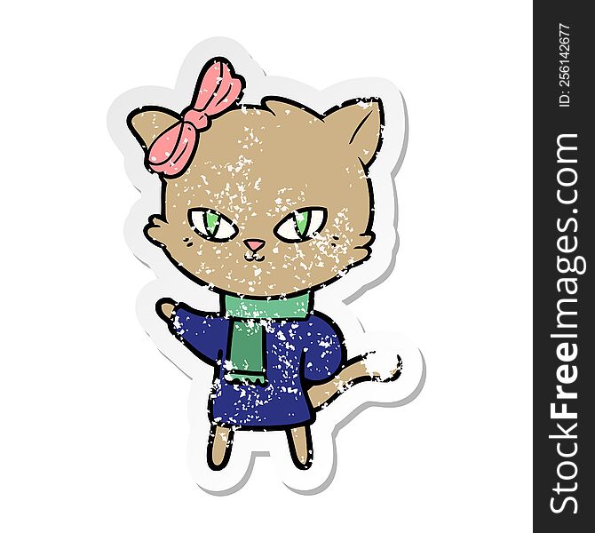 distressed sticker of a cute cartoon cat in winter clothes