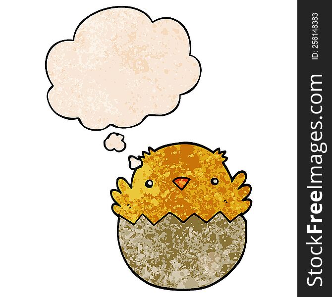 cartoon chick hatching from egg with thought bubble in grunge texture style. cartoon chick hatching from egg with thought bubble in grunge texture style