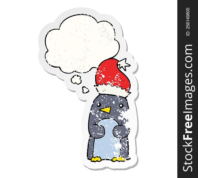 cute christmas penguin with thought bubble as a distressed worn sticker
