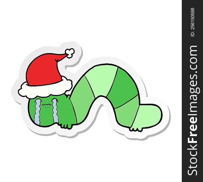 hand drawn sticker cartoon of a caterpillar obsessing over his regrets wearing santa hat