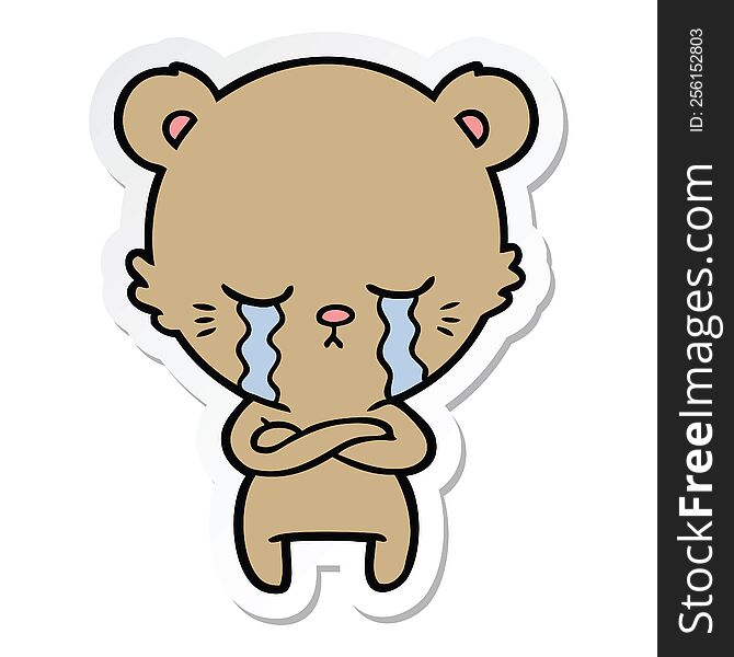 Sticker Of A Crying Cartoon Bear With Folded Arms