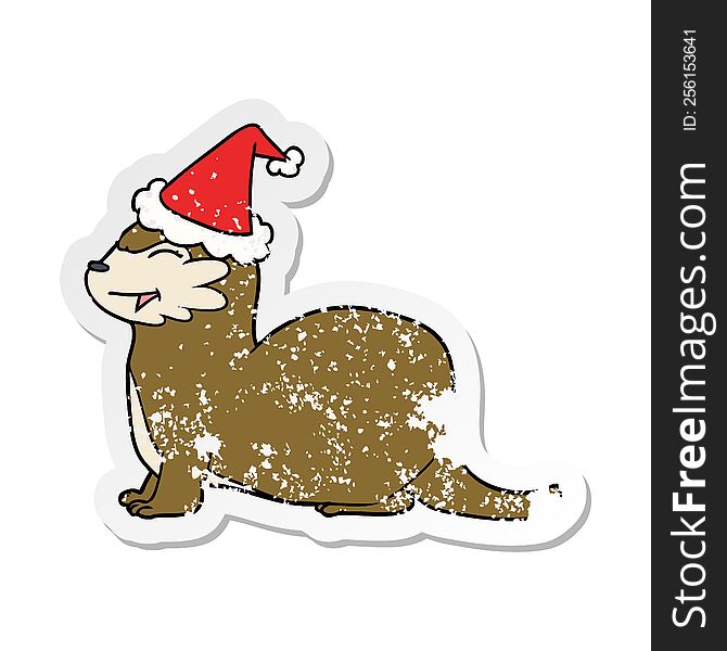 laughing otter hand drawn distressed sticker cartoon of a wearing santa hat