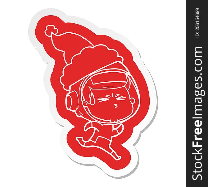 quirky cartoon  sticker of a stressed astronaut wearing santa hat