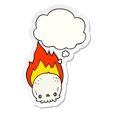 Spooky Cartoon Flaming Skull And Thought Bubble As A Printed Sticker Stock Photo