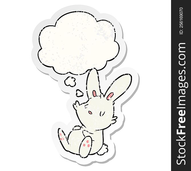 cartoon rabbit sleeping with thought bubble as a distressed worn sticker