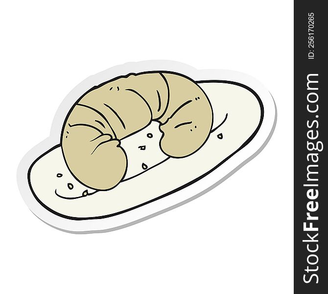 sticker of a cartoon croissant