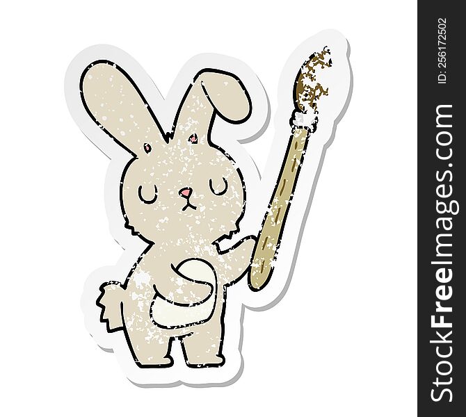 distressed sticker of a cartoon rabbit with paint brush