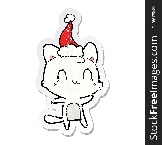 Distressed Sticker Cartoon Of A Happy Cat Wearing Santa Hat