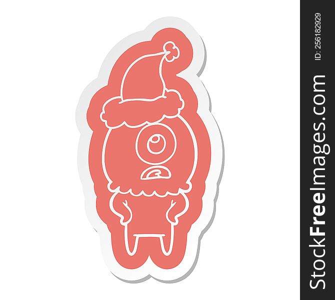 Cartoon  Sticker Of A Cyclops Alien Spaceman Wearing Santa Hat