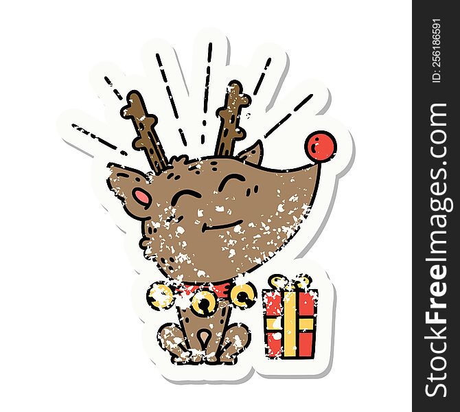 grunge sticker of tattoo style christmas reindeer with present