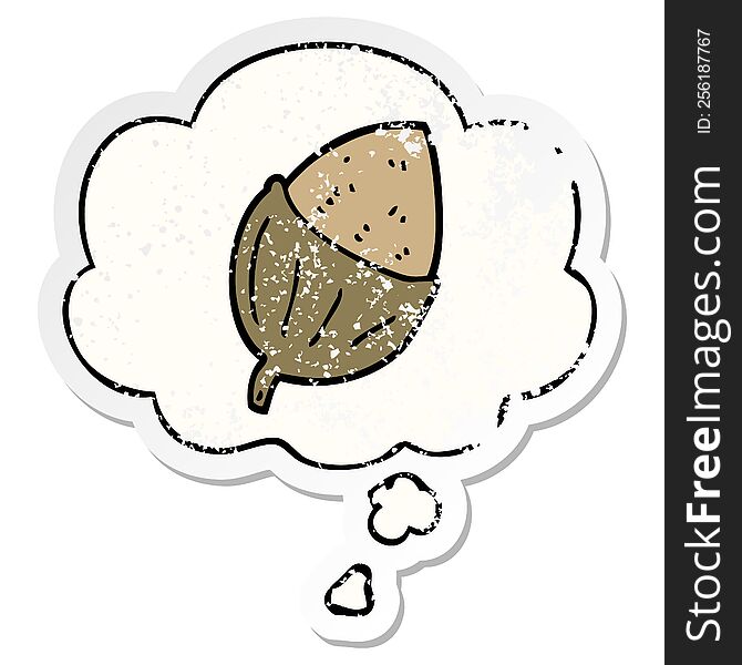cartoon acorn with thought bubble as a distressed worn sticker