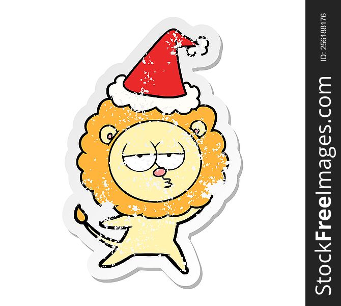 Distressed Sticker Cartoon Of A Bored Lion Wearing Santa Hat