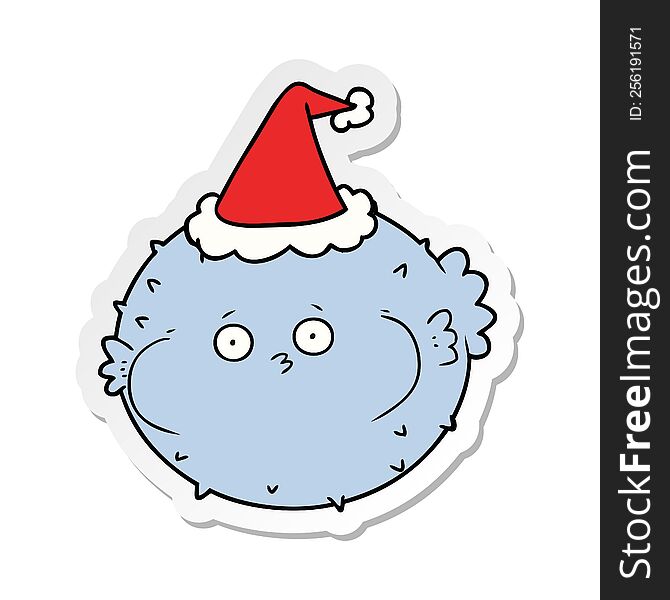 hand drawn sticker cartoon of a puffer fish wearing santa hat