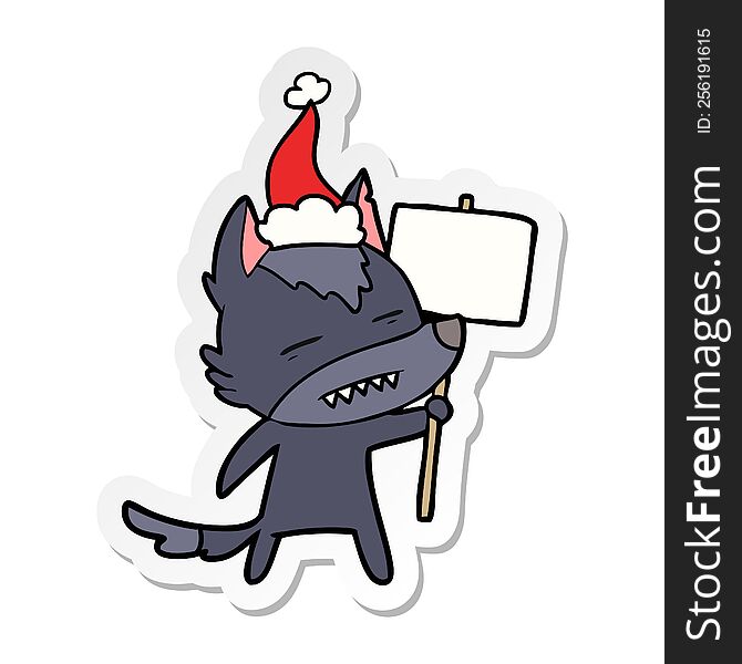 hand drawn sticker cartoon of a wolf with sign post showing teeth wearing santa hat