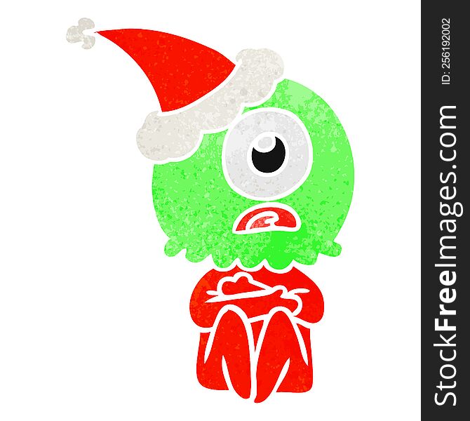 Retro Cartoon Of A Cyclops Alien Spaceman Wearing Santa Hat