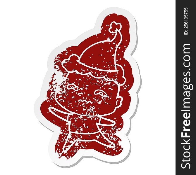 Cartoon Distressed Sticker Of A Nervous Man Wearing Santa Hat