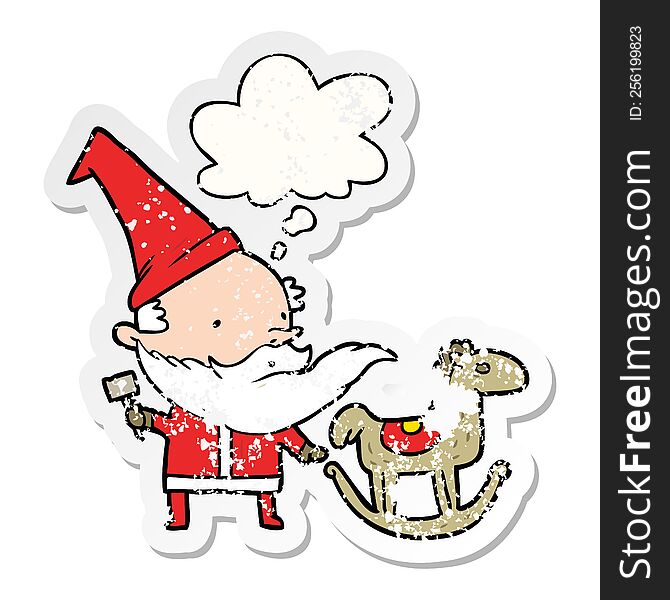 cartoon santa making toy with thought bubble as a distressed worn sticker