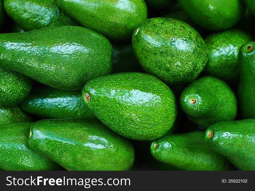 Healthy fresh green-riped avocados.