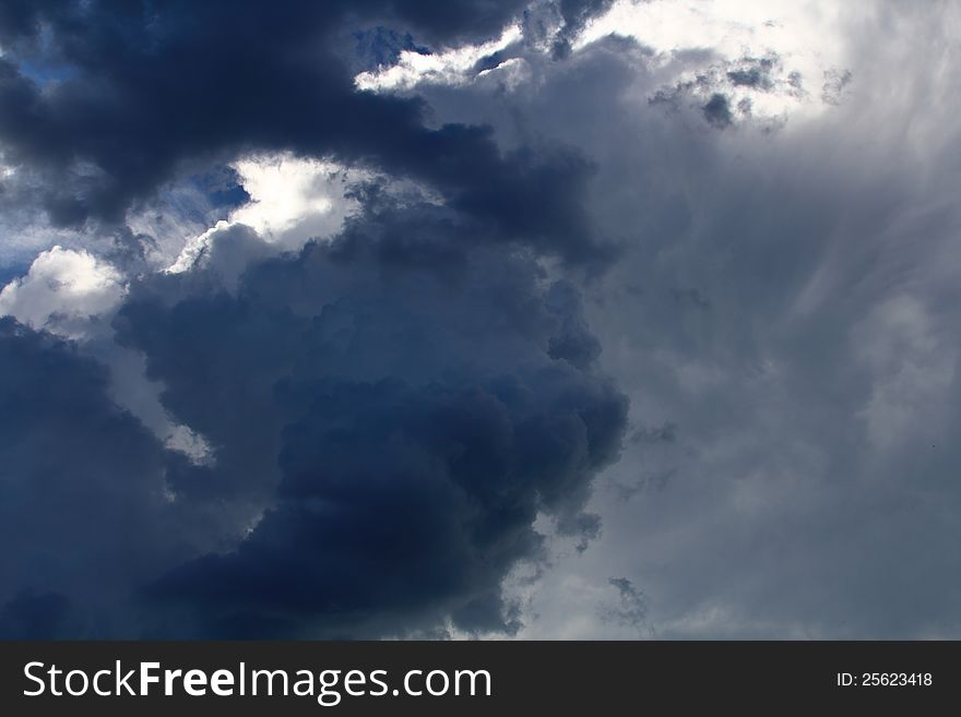 Towering dark storm clouds just before severe weather moves in to the area. Towering dark storm clouds just before severe weather moves in to the area.